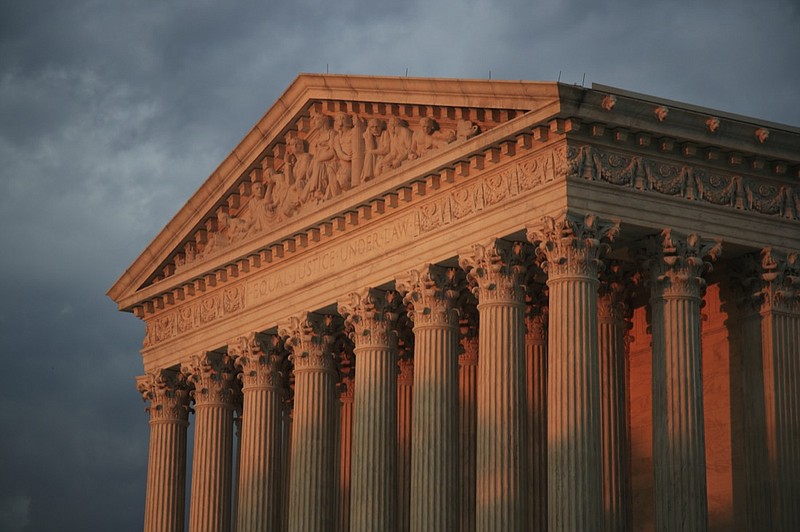 FILE - This Oct. 4, 2018, file photo shows the U.S. Supreme Court at sunset in Washington. Over the objections of the Biden administration, the Supreme Court has agreed to consider a climate change case that could limit the Environmental Protection Agency's authority to curb greenhouse gas emissions. The court also said Oct. 29, 2021, that it would hear a Republican-led immigration challenge. Both cases won't be argued until 2022 at the earliest. (AP Photo/Manuel Balce Ceneta, File)