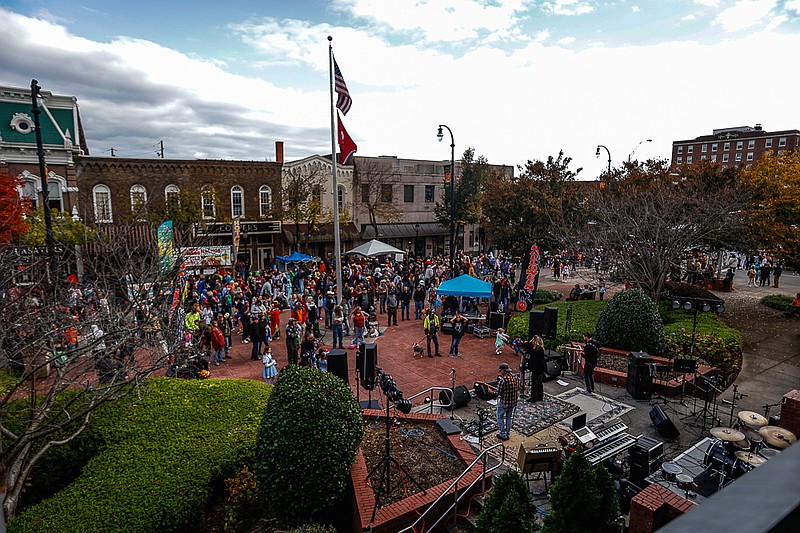 Staff photo by Troy Stolt / Bradley County residents listen to live music at Courthouse Square during the 34th Downtown Halloween Block Party in Cleveland, Tenn on Sunday, Oct. 31, 2021 .