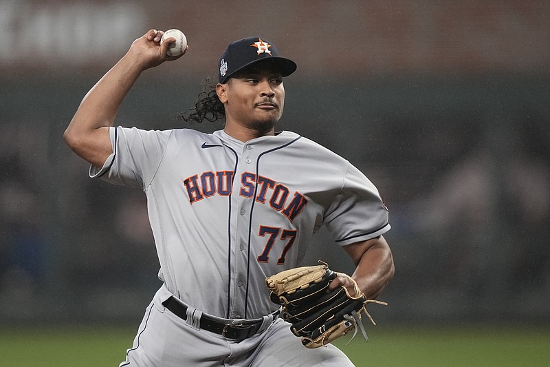 Houston Astros starting pitcher Luis Garcia throws during the first inning in Game 3 of baseball's World Series between the Houston Astros and the Atlanta Braves Friday, Oct. 29, 2021, in Atlanta. (AP Photo/David J. Phillip)