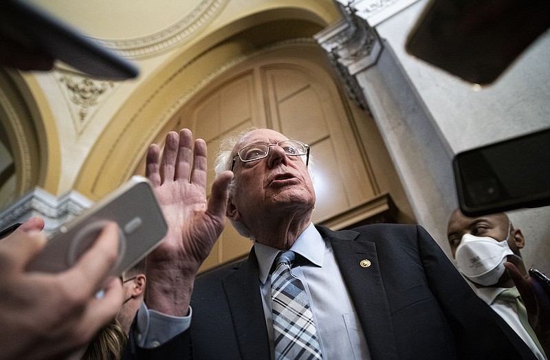 Photo by Al Drago of The New York Times / Sen. Bernie Sanders, I-Vt., speaks with reporters after a vote at the Capitol in Washington on Wednesday, Oct. 27, 2021.