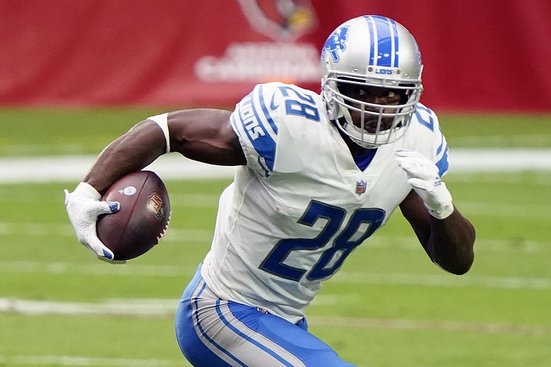 FILE - Detroit Lions running back Adrian Peterson (28) during an NFL football game against the Arizona Cardinals, Sunday, Sept. 27, 2020, in Glendale, Ariz. The Tennessee Titans have signed 2012 NFL MVP and four-time All-Pro running back Adrian Peterson to help replace NFL rushing leader Derrick Henry. The Titans signed Peterson on Tuesday, Nov. 2, 2021, to the practice squad with Peterson, 36, not having been with an NFL team this season. (AP Photo/Rick Scuteri, File)