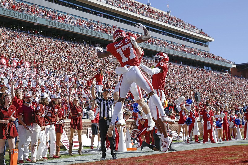 Oklahoma wide receiver Marvin Mims (17) celebrates after scoring a touchdown during the first half an NCAA college football game against Texas Tech, Saturday, Oct. 30, 2021, in Norman, Okla. (AP Photo/Alonzo Adams)