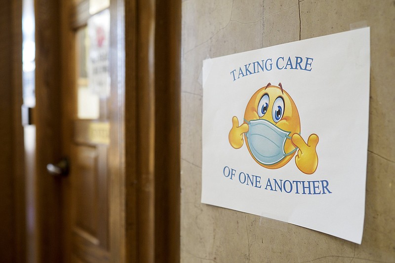 Staff photo by C.B. Schmelter / A sign promoting mask wearing is seen outside of the Trustee's office at the Hamilton County Courthouse on Wednesday, Feb. 10, 2021 in Chattanooga, Tenn.