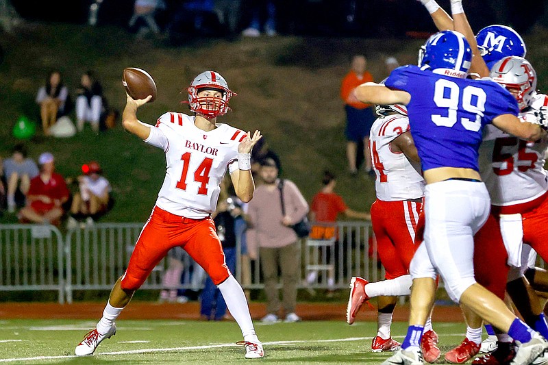 Staff photo by Troy Stolt / Baylor quarterback Cooper Wick (14) throws during the Red Raiders' Oct. 1 game against Chattanooga rival McCallie. The Red Raiders (6-4) will travel to Ensworth (7-3) for the first round of the Division II-AAA playoffs on Friday.