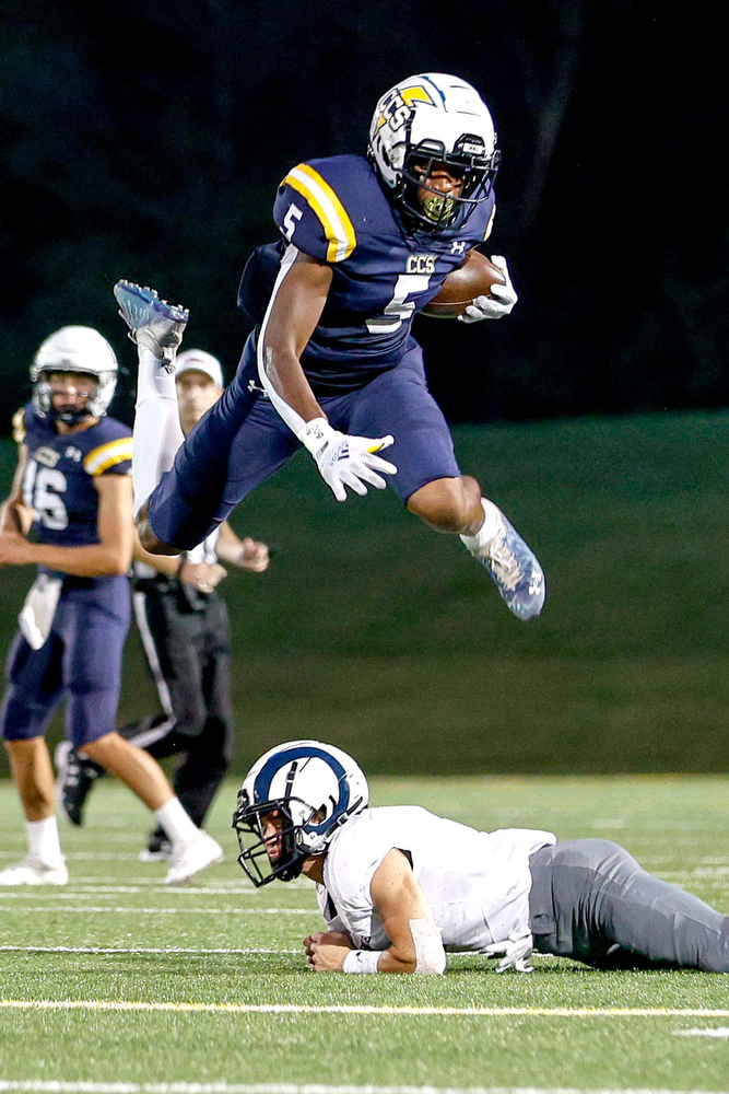 Staff file photo by Troy Stolt / Chattanooga Christian School running back Javoris Havis hurdles a would-be tackler from Knoxville's Grace Baptist Academy. CCS (5-4) will travel to Battle Ground Academy (5-5) for the first round of the Division II-AA playoffs on Friday.