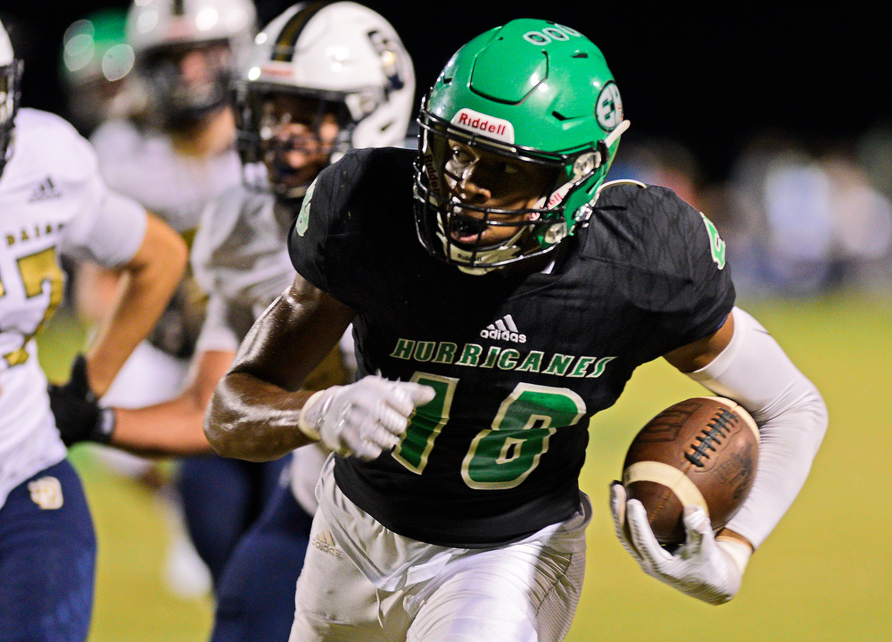 Staff file photo by Robin Rudd / East Hamilton's Kaunyae Burgans picks up yardage after a catch. East Hamilton (7-2) will host DeKalb County (6-4) for the first round of the Class 4A playoffs on Friday.