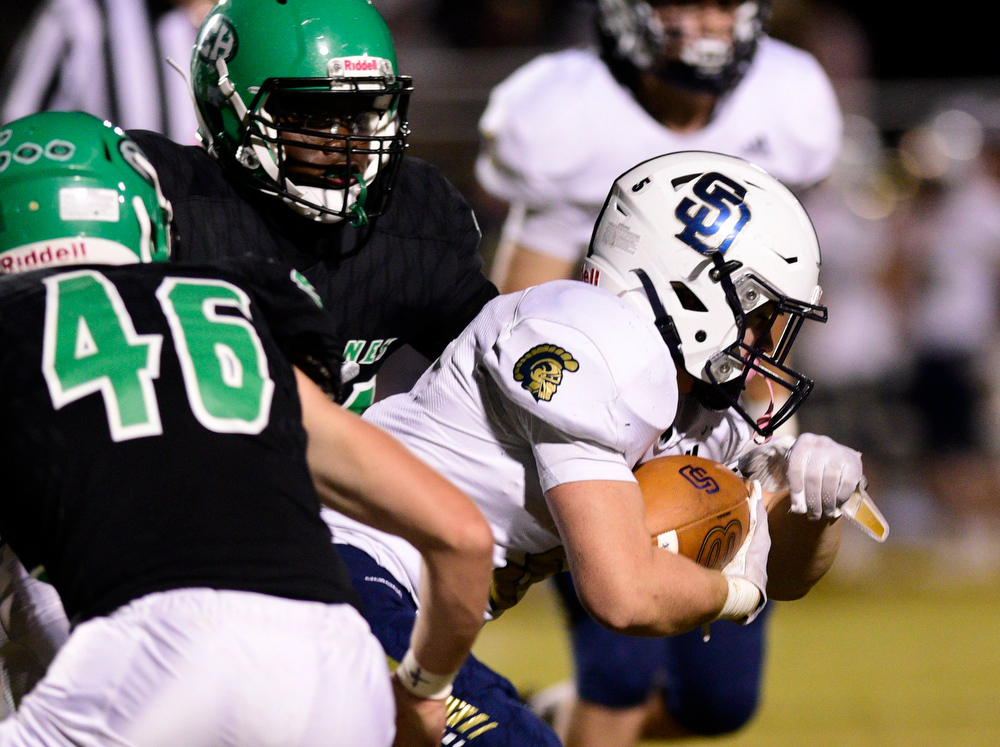 Staff file photo by Robin Rudd / Soddy-Daisy's Tanner Whittenbarger, right, gets between two East Hamilton defenders. Soddy-Daisy (5-6) will travel to Upperman (9-1) for the first round of the Class 4A playoffs on Friday.