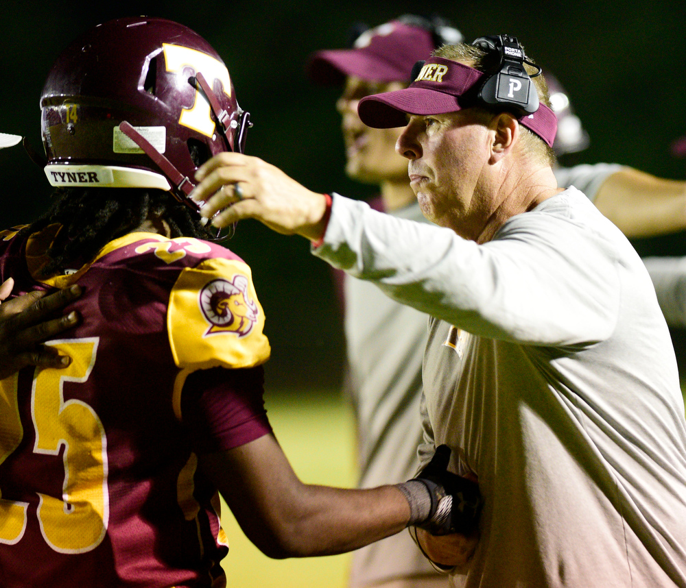 Staff file photo by Robin Rudd / Tyner football coach Scott Chandler congratulates Ro' Shaun Holloway after he scored a touchdown. The Rams (7-3) will travel to Trousdale County (8-1) for the first round of the Class 2A playoffs on Friday.