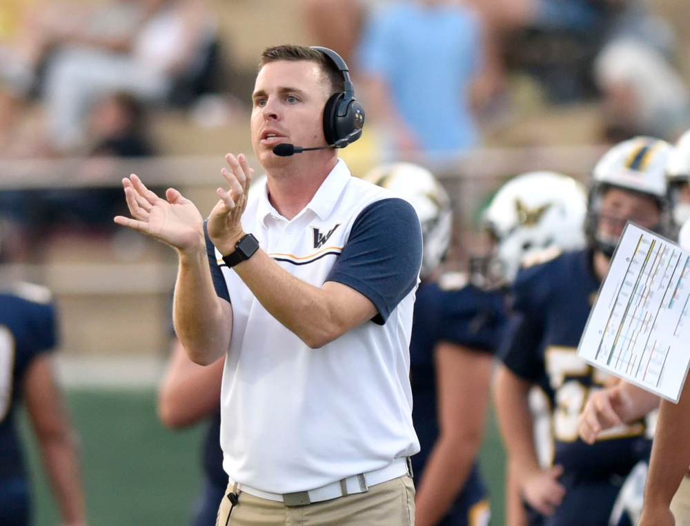 Staff file photo by Robin Rudd / Walker County football coach Drew Akins signals to his offense. The Mustangs (5-5) will travel to Karns (6-4) for the first round of the Class 5A playoffs on Friday.