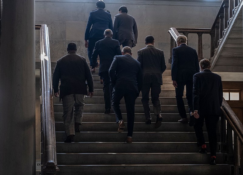 Legislators head upstairs in the Capitol. (Photo: John Partipilo)