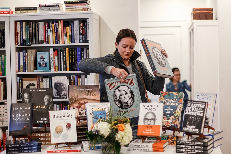 Staff photo by Troy Stolt / Sarah Prehmus browses for books at the newly opened Book and Cover indie bookstore on Thursday, Nov. 4, 2021 in Chattanooga, Tenn. Book and Cover officially opened for business on Thursday.