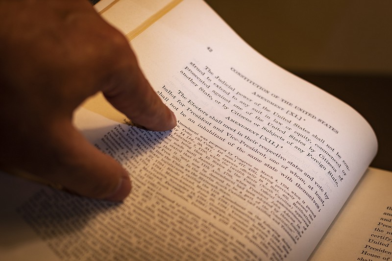 Photo from Getty Images / Open book shows Twelfth Amendment to the Constitution of the United States of America.