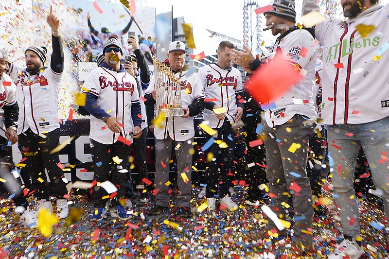 AP photo by John Bazemore / Atlanta Braves manager Brian Snitker holds the Commissioner's Trophy during the team's World Series celebration Friday at Truist Park. The Braves celebrated their six-game triumph over the Houston Astros with a two-part parade Friday, starting at the site of their former stadiums and winding up at their current home.