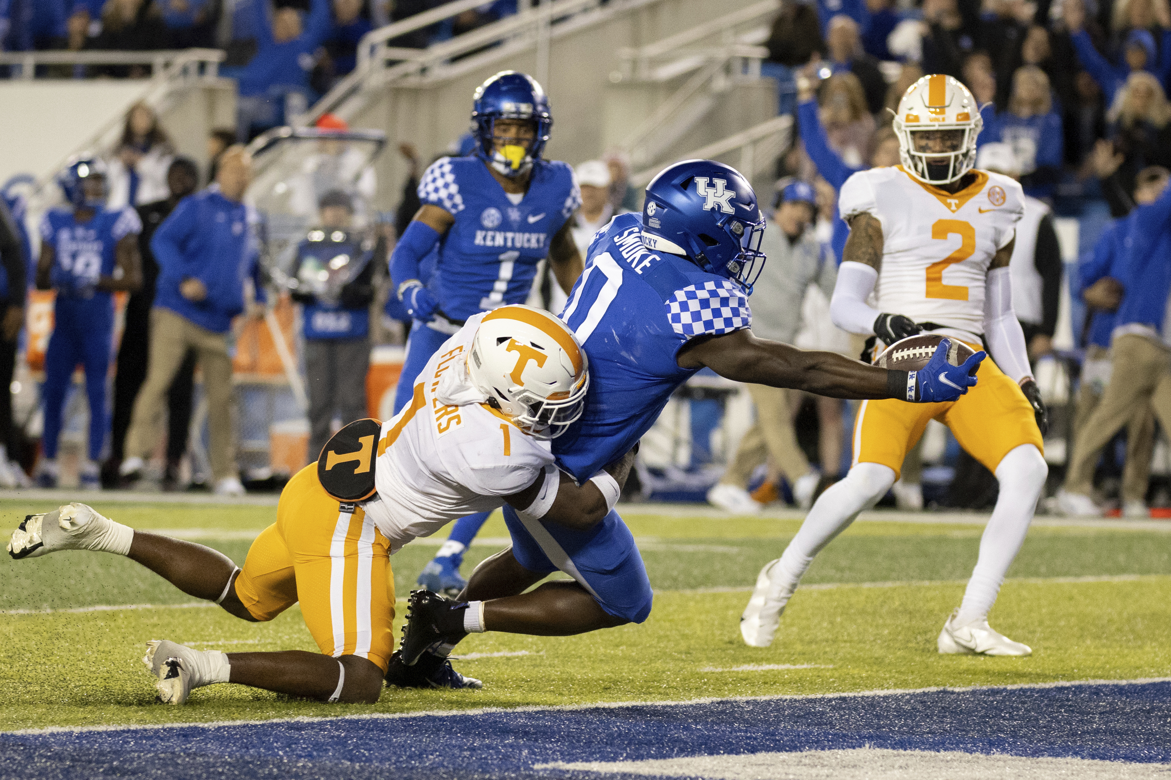 AP photo by Michael Clubb / Kentucky running back Kavosiey Smoke (0) stretches out for a touchdown during the first half of Saturday's home game against Tennessee.