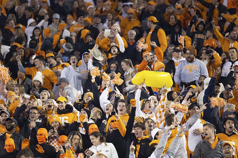 AP photo by Michael Club / Tennessee football fans celebrate Saturday night at Kentucky's Kroger Field. The Vols' win in Lexington put them back above .500 overall at 5-4 and evened their SEC record at 3-3 in Josh Heupel's first season as coach.