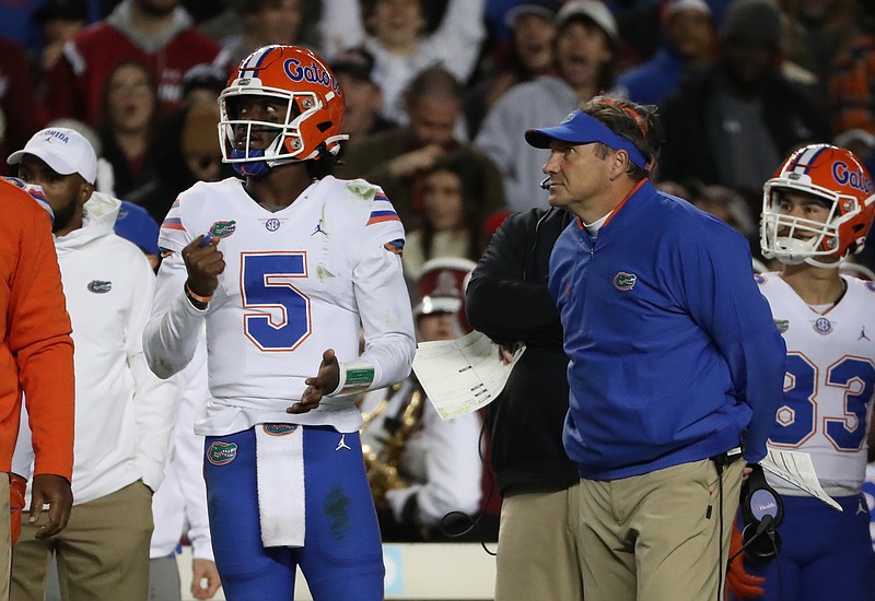 Florida Athletics photo by Tim Casey / Florida quarterback Emory Jones and Gators coach Dan Mullen watch from the sideline during Saturday night's shocking 40-17 loss at South Carolina.