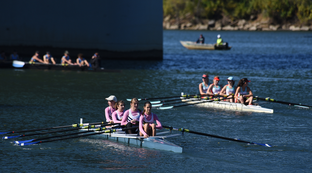 Staff Photo by Matt Hamilton / Teams leave the dock to paddle to the starting point of the race on Sunday November 7, 2021 during the Head of the Hooch regatta.