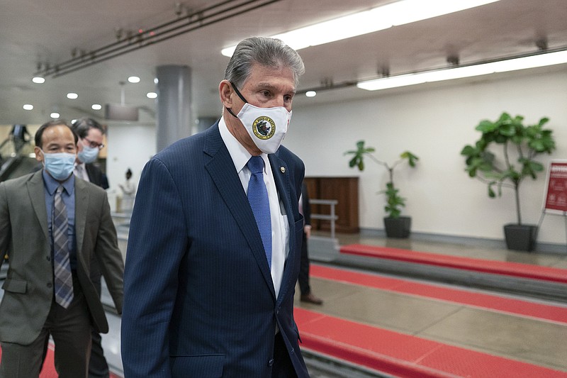 Photo by Carolyn Kaster of The Associated Press / Sen. Joe Manchin, D-WVa., walks through the subway on Capitol Hill in Washington on Thursday, Nov. 4, 2021.