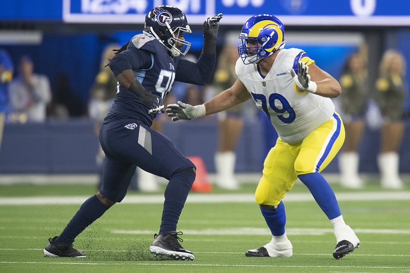 Tennessee Titans defensive tackle Anthony Rush (95) and Los Angeles Rams offensive tackle Rob Havenstein (79) face off during an NFL Professional Football Game Sunday, Nov. 7, 2021, in Inglewood, Calif. (AP Photo/John McCoy)