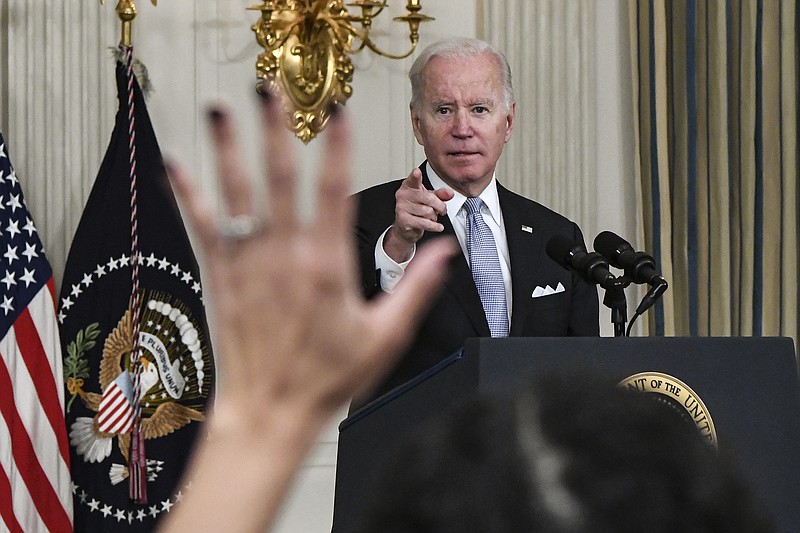 New York Times photo by Kenny Holston / President Joe Biden takes questions Saturday at the White House from reporters during a news conference about the House infrastructure vote on Friday.