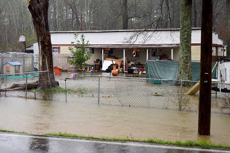 Staff File Photo by Robin Rudd / Water from heavy rains fills the front yard of this house on Graysville Road in East Brainerd on February 6, 2020. The Federal Emergency Management Agency is changing its pricing methodology for the federal flood insurance program.