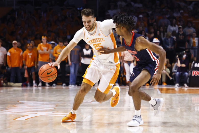 Tennessee guard Santiago Vescovi (25) drives against Tennessee-Martin guard Mikel Henderson (3) during an NCAA college basketball game Tuesday, Nov. 9, 2021, in Knoxville, Tenn. (AP Photo/Wade Payne)