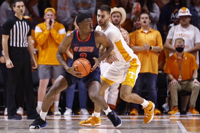 Tennessee-Martin guard Mikel Henderson (3) works the ball against Tennessee guard Santiago Vescovi (25) during an NCAA college basketball game Tuesday, Nov. 9, 2021, in Knoxville, Tenn. (AP Photo/Wade Payne)