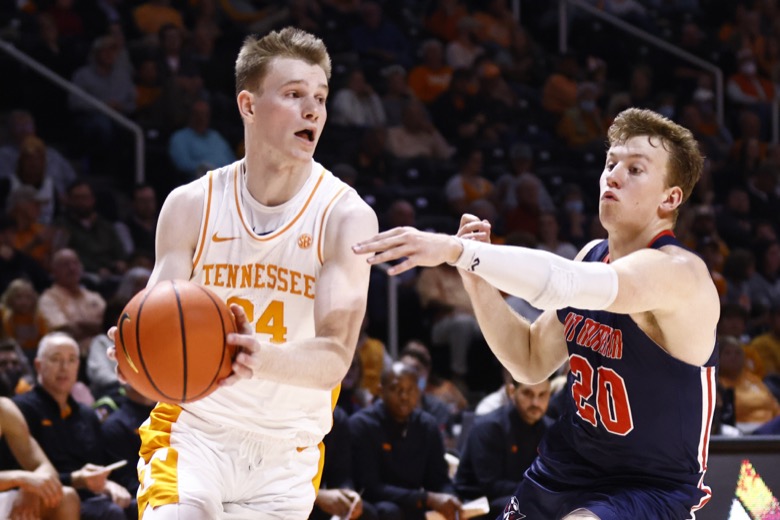 Tennessee guard Justin Powell (24) drives against Tennessee-Martin guard Josiah Morris (20) during an NCAA college basketball game Tuesday, Nov. 9, 2021, in Knoxville, Tenn. Tennessee won 90-62. (AP Photo/Wade Payne)