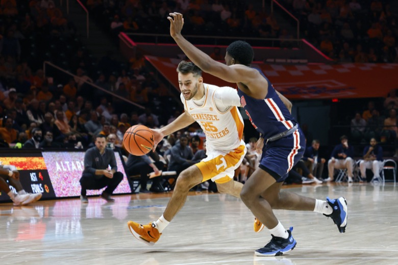 Tennessee guard Santiago Vescovi (25) drives as heÕs pressured by Tennessee-Martin guard KJ Simon (2) during an NCAA college basketball game Tuesday, Nov. 9, 2021, in Knoxville, Tenn. Tennessee won 90-62. (AP Photo/Wade Payne)