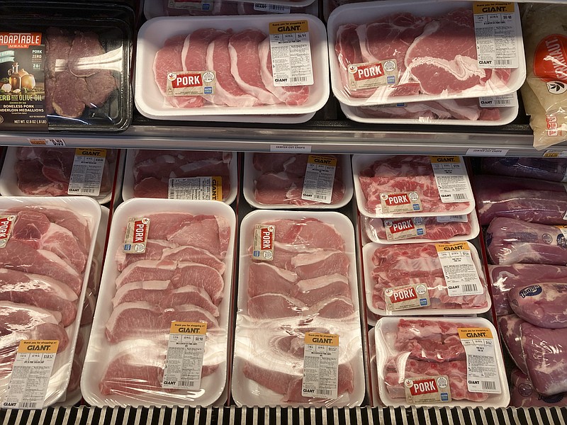 Shown are pork products at a grocery store in Roslyn, Pa., Tuesday, June 15, 2021.  The Labor Department reported Thursday Oct. 14,  that the monthly increase in its producer price index, which measures inflationary pressures before they reach consumers, was 0.5% for September compared to a 0.7% gain in August. (AP Photo/Matt Rourke)