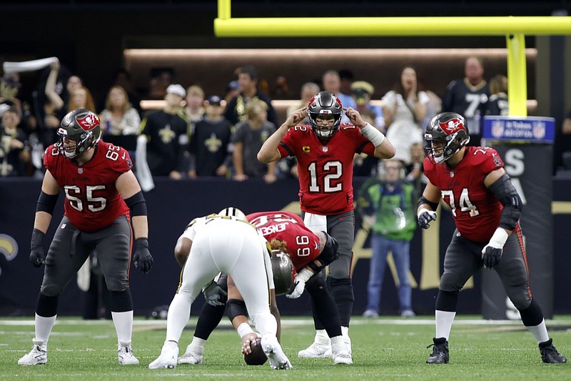 Tampa Bay Buccaneers quarterback Tom Brady (12) calls a play during an NFL football game against the New Orleans Saints, Sunday, Oct. 31, 2021, in New Orleans. (AP Photo/Tyler Kaufman)