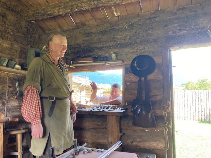 Contributed Photo by Patti Smith / A gunsmith, left, and blacksmith (in the window) explain their craft to visitors at Wilderness Road State Park, Virginia, a few miles from Cumberland Gap.