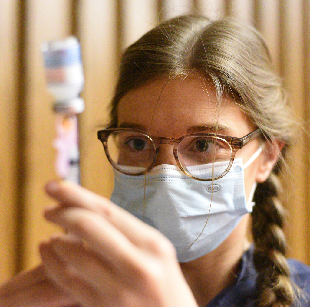 Staff Photo by Matt Hamilton / Nurse practitioner Meghan Whitehead draws a booster dose of the Moderna vaccine on Friday, November 13, 2021 at the downtown branch of the Chattanooga Public Library. Lifespring Community Health was providing vaccination shots to children as young as five years old on Friday.