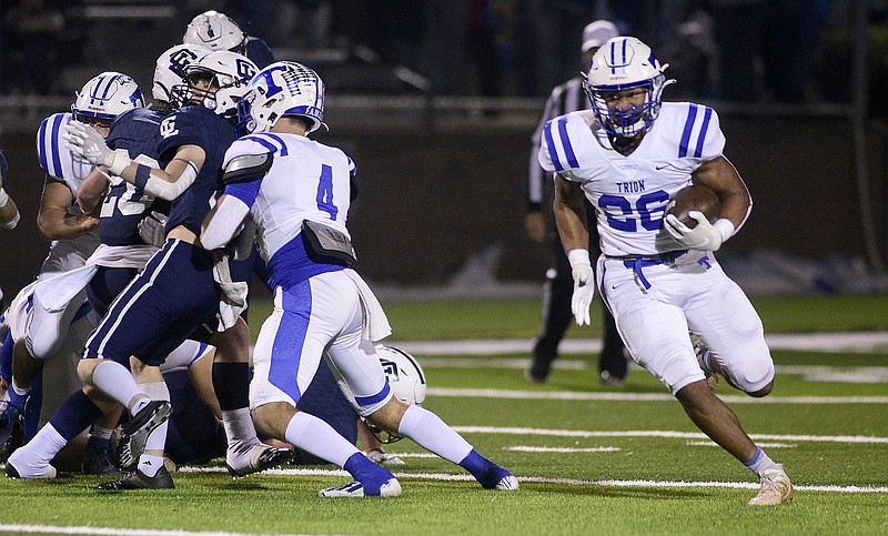 Staff file photo by Robin Rudd / Trion's Rob Brown, right, rushed for 443 yards on 45 carries, including four touchdowns, to help lead the Bulldogs to a first-round win against Social Circle in the GHSA Class A public playoffs Saturday night. Brown also caught a touchdown pass in the 55-21 victory.