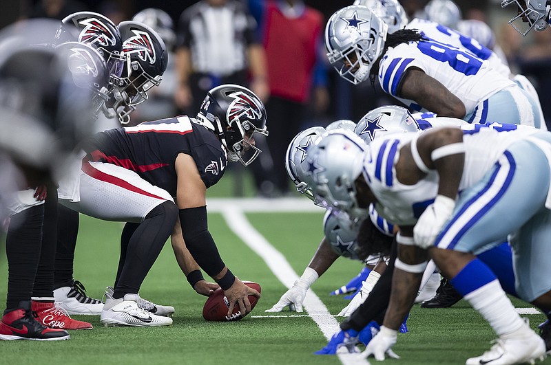 AP photo by Brandon Wade / The Atlanta Falcons' offense lines up against the Dallas Cowboys' defense during Sunday's game in Arlington, Texas.