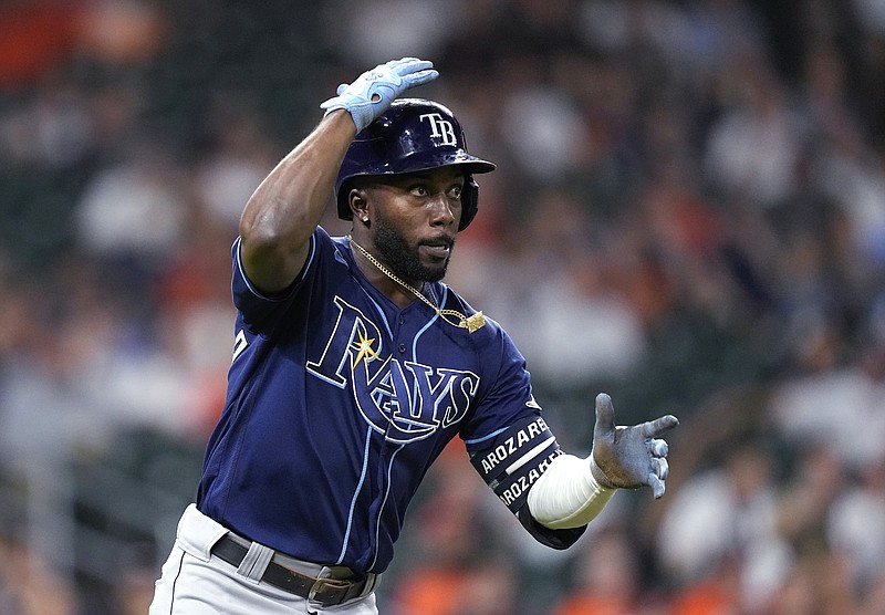 FILE -Tampa Bay Rays' Randy Arozarena watches his home run against the Houston Astros during the ninth inning of a baseball game Sept. 28, 2021, in Houston. Arozarena won AL Rookie of the Year honor on Monday night, Nov. 15. (AP Photo/David J. Phillip, File)