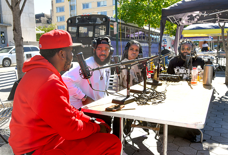 Photo by Mark Gilliland / Askin 4 A Friend does a live interview for a podcast.