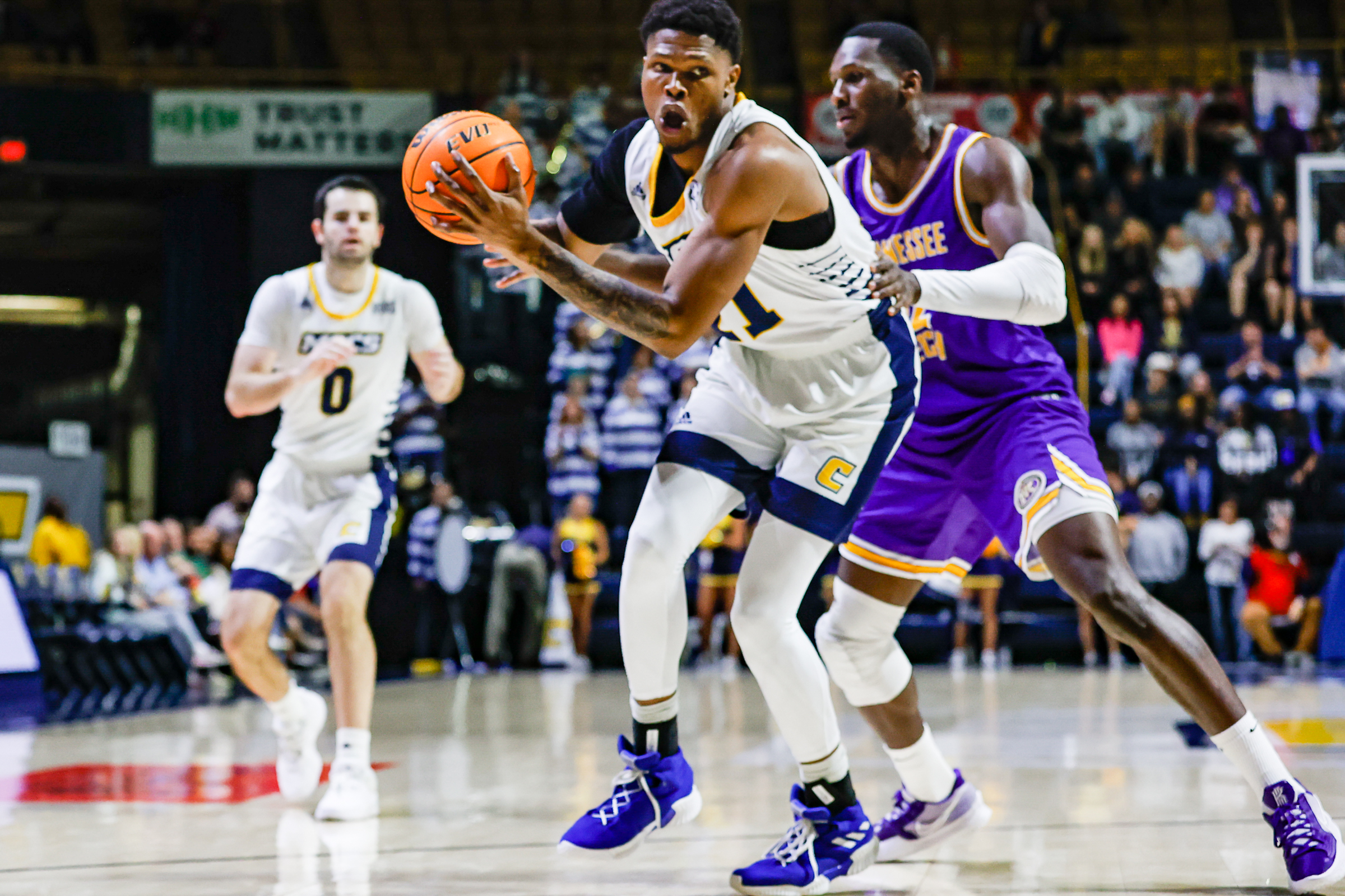 Staff photo by Troy Stolt / Mocs forward Josh Ayeni (21) drives to the basket during UTC's home basketball game against the Tennessee Tech Golden Eagles at McKenzie Arena on Tuesday, Nov. 16, 2021 in Chattanooga, Tenn.