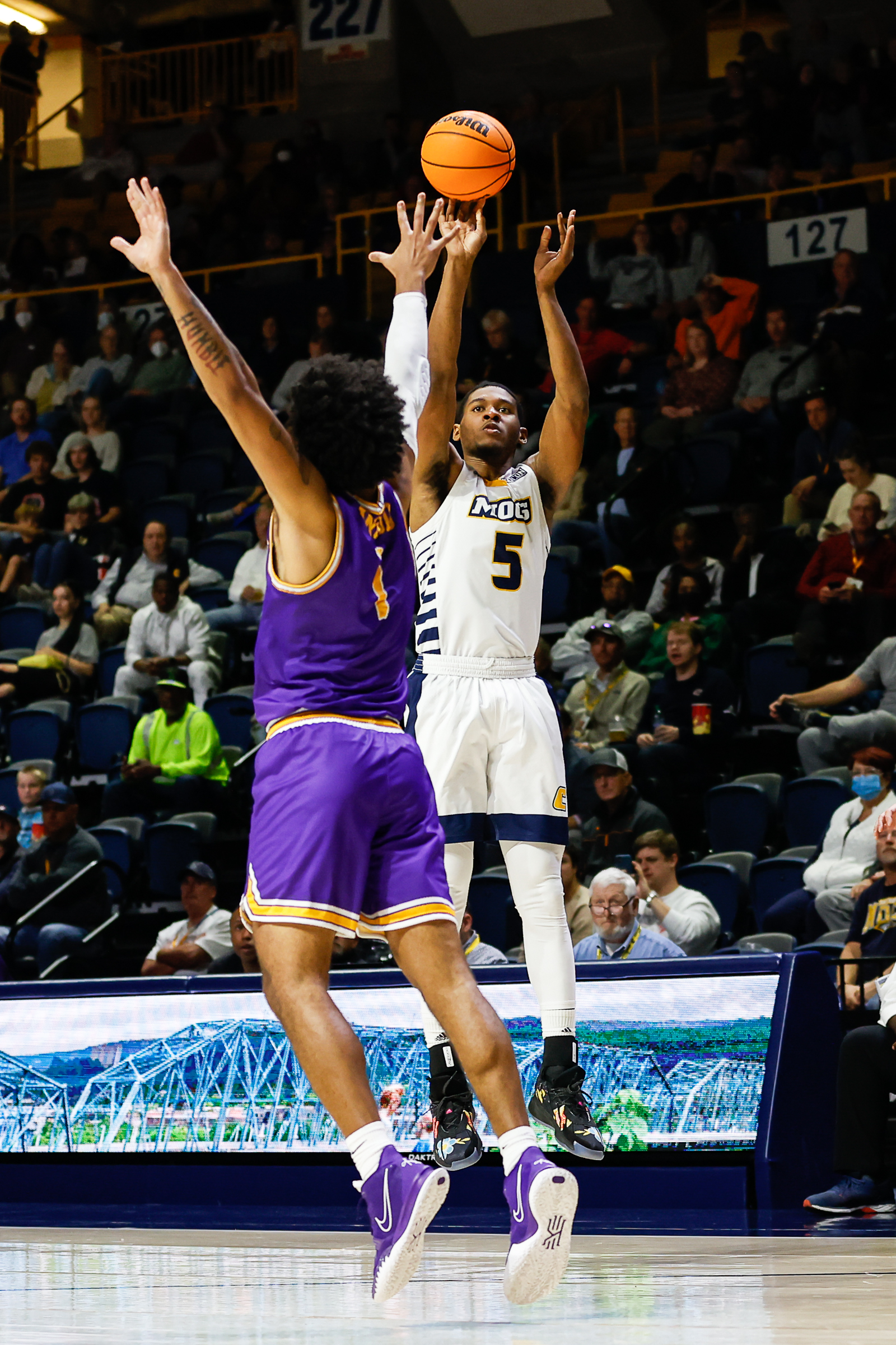 Staff photo by Troy Stolt / Mocs forward Darius Banks (5) shoots a three pointer during UTC's home basketball game against the Tennessee Tech Golden Eagles at McKenzie Arena on Tuesday, Nov. 16, 2021 in Chattanooga, Tenn.