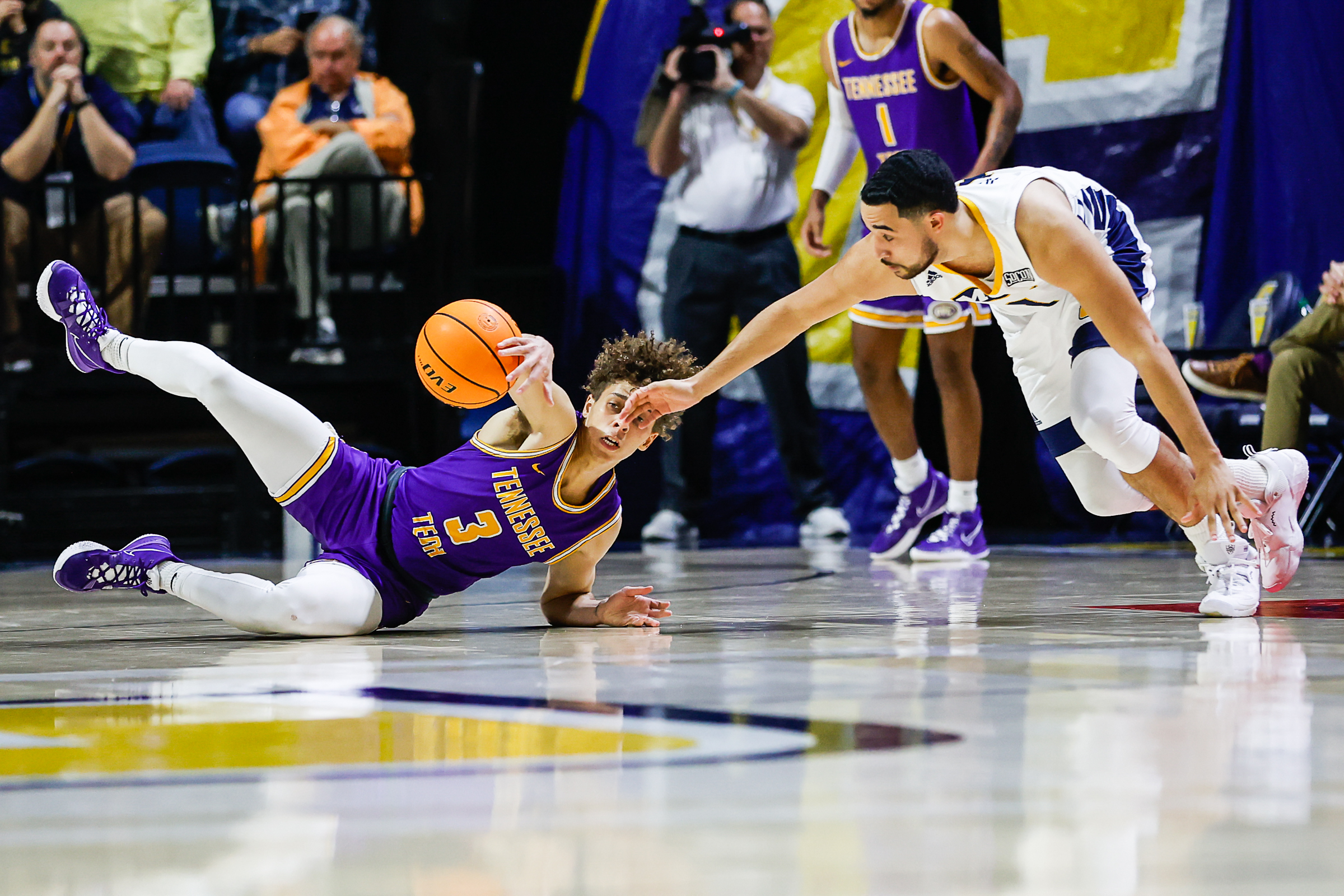 Staff photo by Troy Stolt / Tennessee Tech Golden Eagles guard Keishawn Davidson (3) and Mocs forward KC Hankton (1) fight for a loose ball during UTC's home basketball game against the Tennessee Tech Golden Eagles at McKenzie Arena on Tuesday, Nov. 16, 2021 in Chattanooga, Tenn.