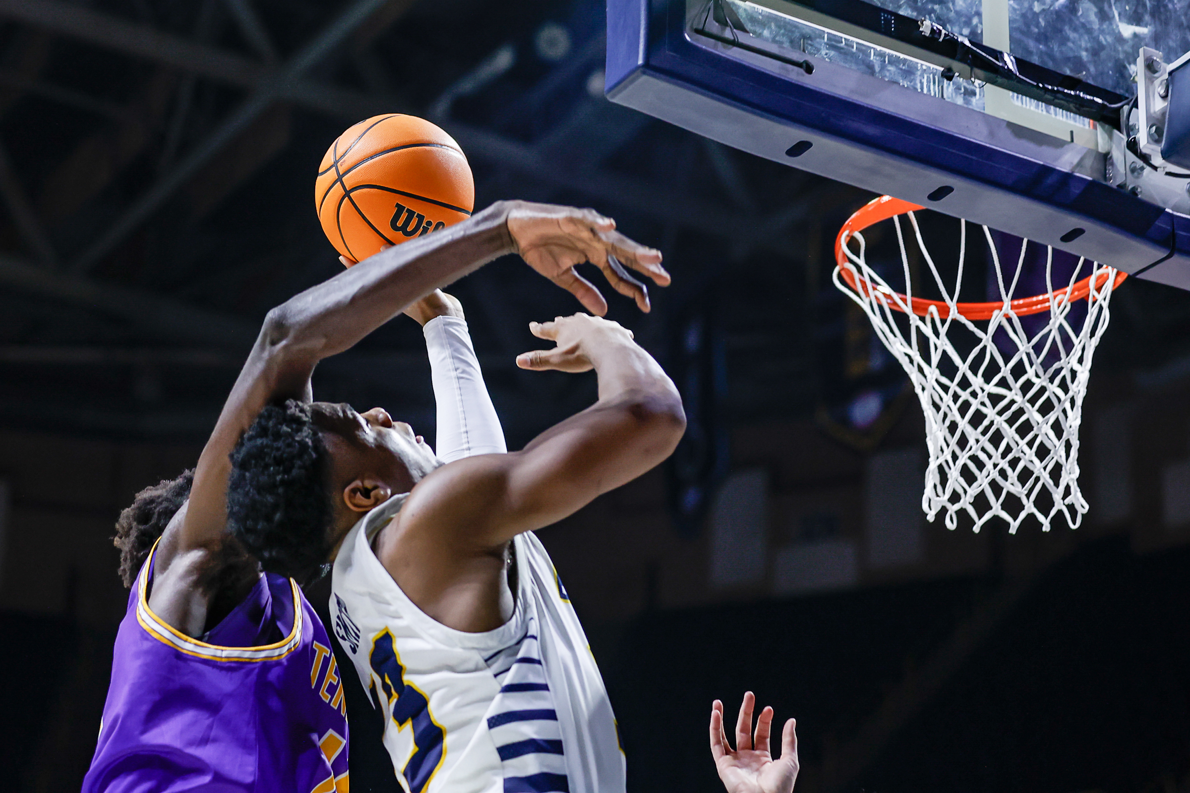 Staff photo by Troy Stolt / Mocs guard Malachi Smith (13) is fouled while going for a layup during UTC's home basketball game against the Tennessee Tech Golden Eagles at McKenzie Arena on Tuesday, Nov. 16, 2021 in Chattanooga, Tenn.