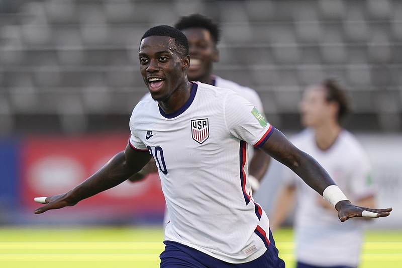 The United States' Tim Weah celebrates scoring his side's opening goal against Jamaica during a qualifying soccer match for the FIFA World Cup Qatar 2022 in Kingston, Jamaica, on Tuesday.