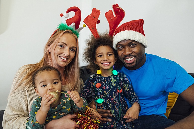 Getty Images / A family of four takes a selfie, capturing the real reason for the season: each other.