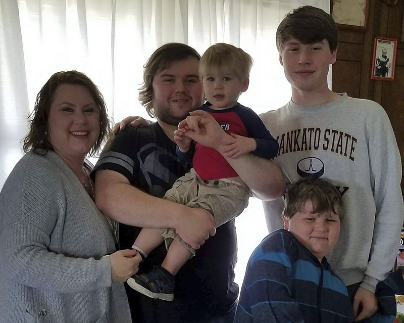 This photo provided by Nancy Sack shows from left, Kim Gustavson, Matthew Gustavson, Isaac Gustavson, Travis Gustavson, and Carter Lange. Nancy Sack's grandson, Travis Gustavson, died at age 21 in Mankato after overdosing on what he thought was heroin but was actually laced with fentanyl. (Katie Tettam/Nancy Sack via AP)


