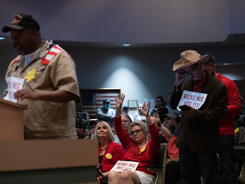 Photo by Ash Adams of The New York Times / Some opponents of a mask mandate wear a yellow Stars of David with the words, "Do Not Comply," during an Anchorage Assembly at Loussac Library in Anchorage, Alaska, on Sept. 28, 2021.
