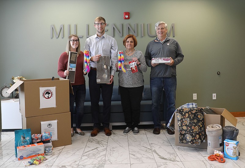 Contributed photo / Millennium Bank representatives, left to right, Courtney Moore, Branch Operations Assistant Manager; Bennett Taylor, Credit Analyst; Gale Williams, Retail Market Manager; Brett Johnson, Chief Risk Officer are pictured with some of the donations for Chattanooga's Humane Educational Society.