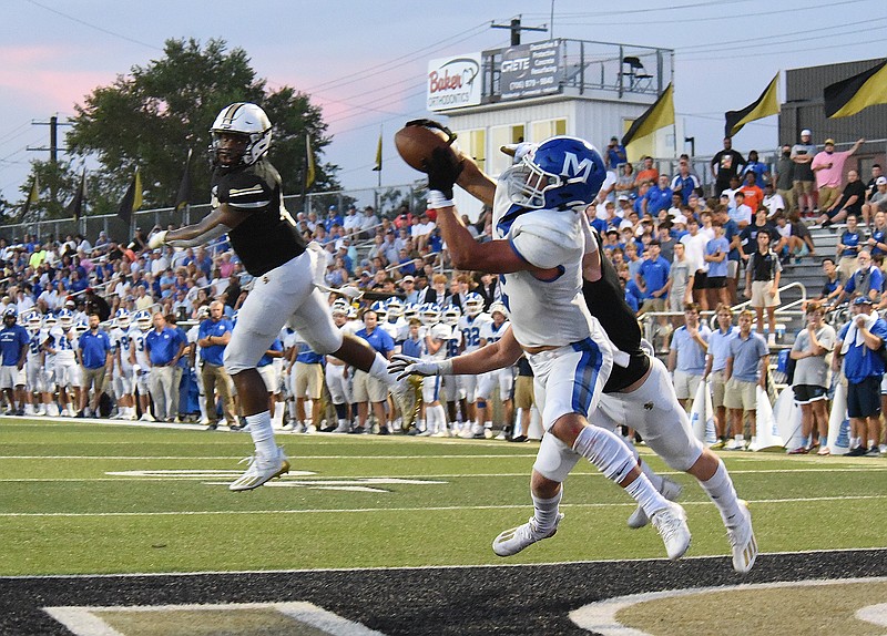 Staff photo by Matt Hamilton / McCallie's Xavier Gaillardetz beats two defenders as he makes a touchdown catch in the end zone against host Calhoun on Aug. 27.