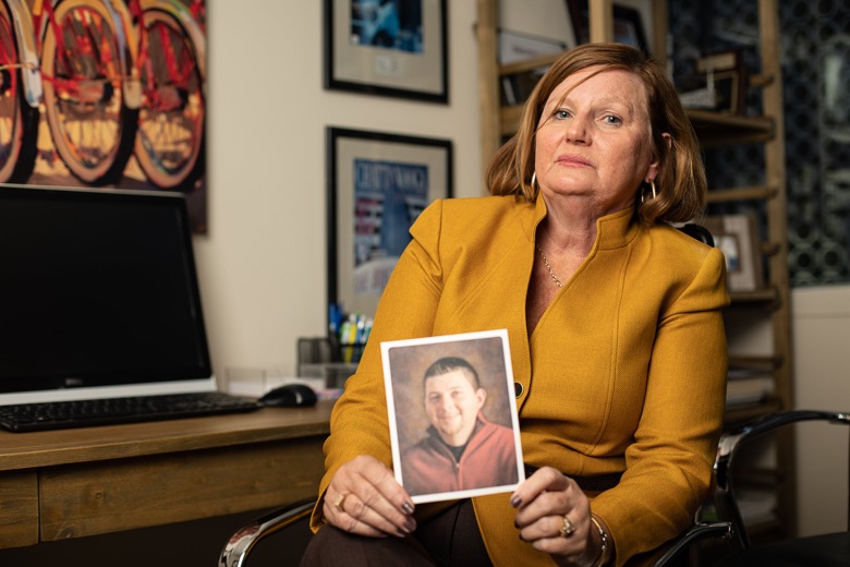 Staff photo by Troy Stolt / Brenda Purcell poses for a portrait on Wednesday, Nov. 10, 2021 in Chattanooga, Tenn holding a photo of her son Jarrod, who died of a fentanyl overdose while seeking treatment for opioid addiction disorder.