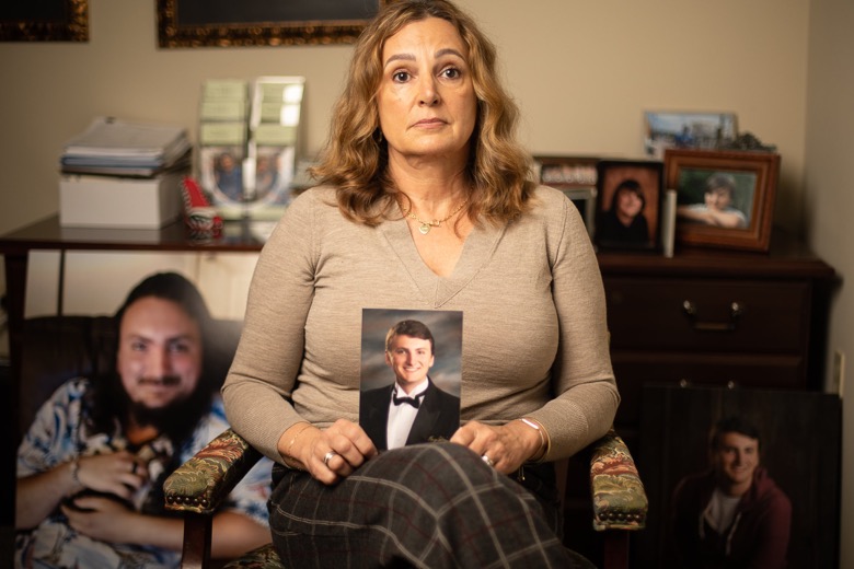 Staff photo by Troy Stolt / On Nov. 18, 2021, in Signal Mountain, Tenn., Lisa Jarvis poses for a portrait with photos of her son Logan, who died of a fentanyl overdose.