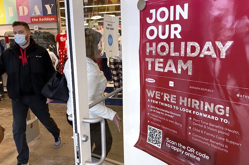 Holiday hiring sign is displayed at a retail store in Vernon Hills, Ill., Saturday, Nov. 13, 2021. (AP Photo/Nam Y. Huh)


